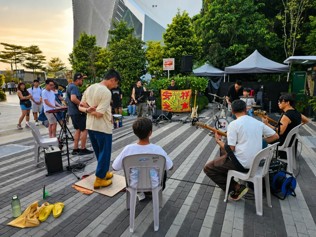 Musicians taking part in an outdoor jam session at Ann Siang Sounds in Singapore